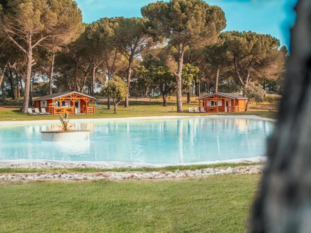 Wooden bungalows by the natural lake-pool