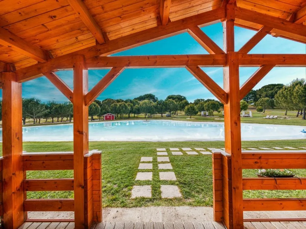 View of the lake-pool from a bungalow porch